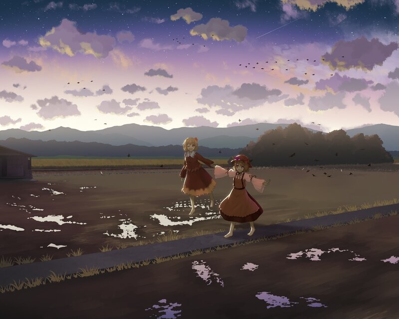 Two girls in a field at dusk
