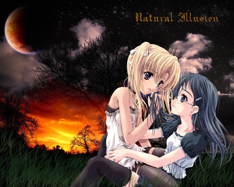Two girls in a field at sunset