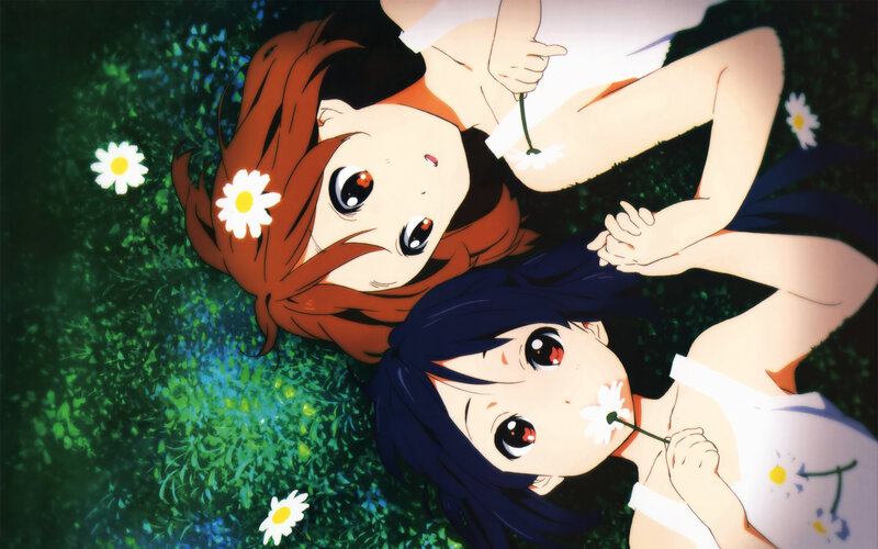 Two girls in a field of daisies