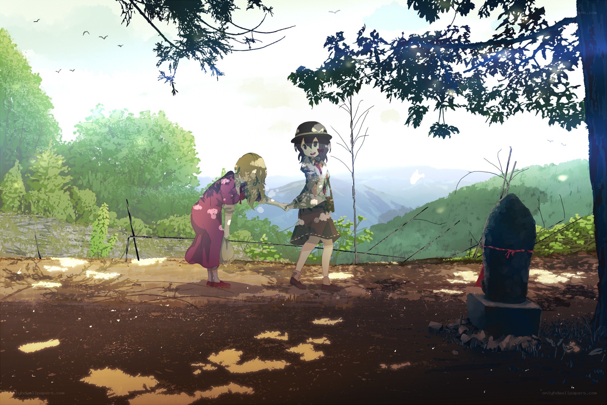 Two girls in a forest clearing