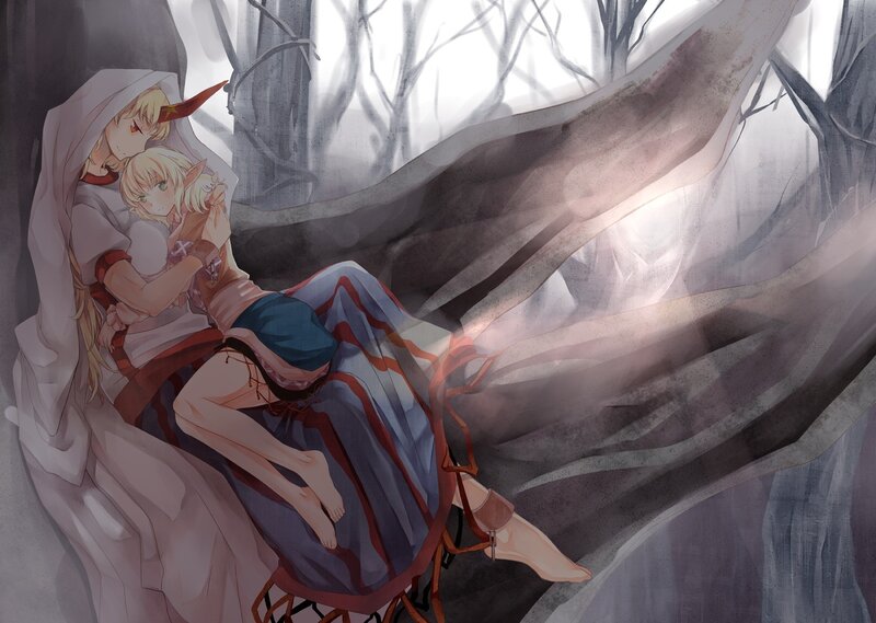 Two girls in a forest embrace
