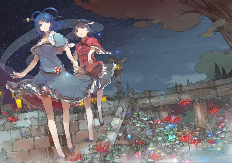 Two girls in a garden at night