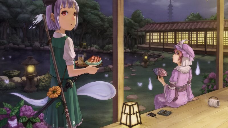 Two girls in a garden at night