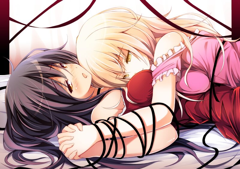 Two girls in a passionate embrace