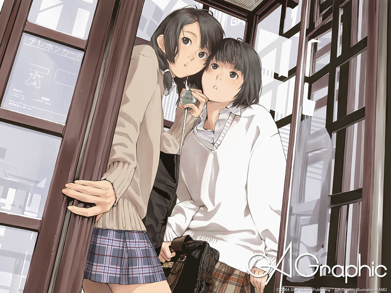 Two girls in a phone booth