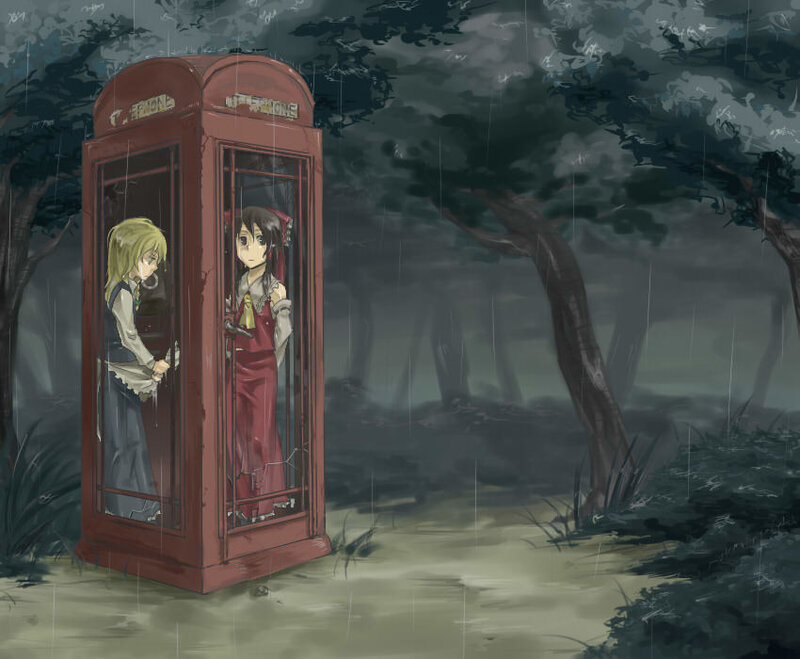 Two girls in a phone booth