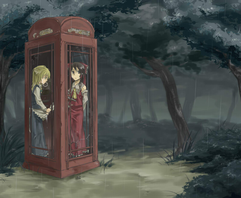 Two girls in a phone booth