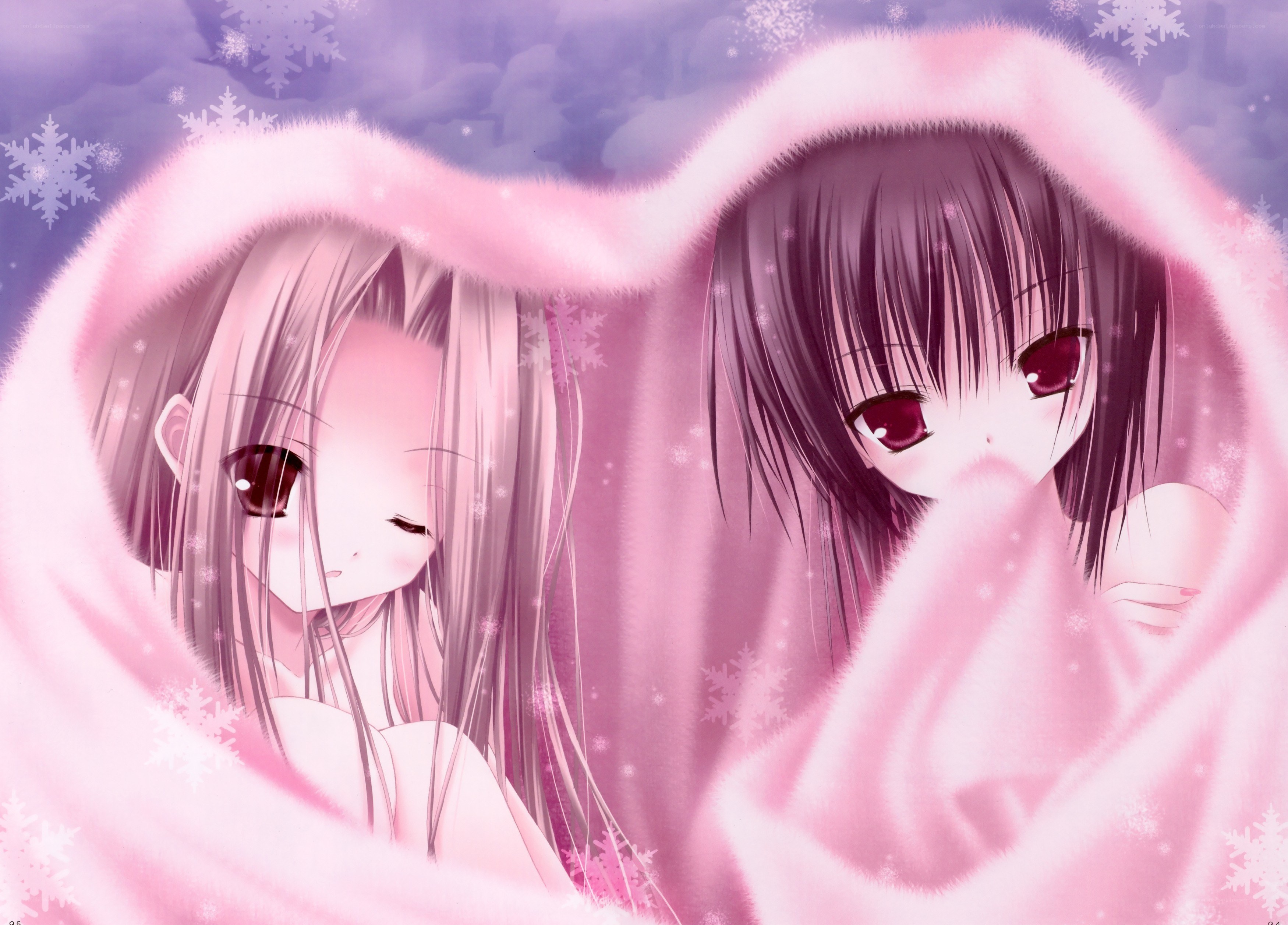 two girls in a pink blanket