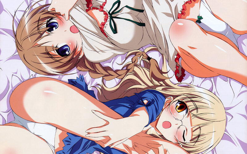 Two girls in a playful embrace