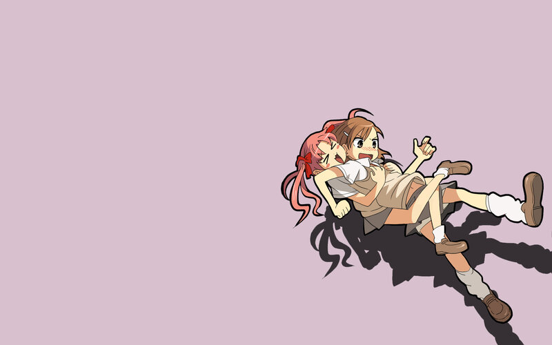 Two girls in a playful tussle