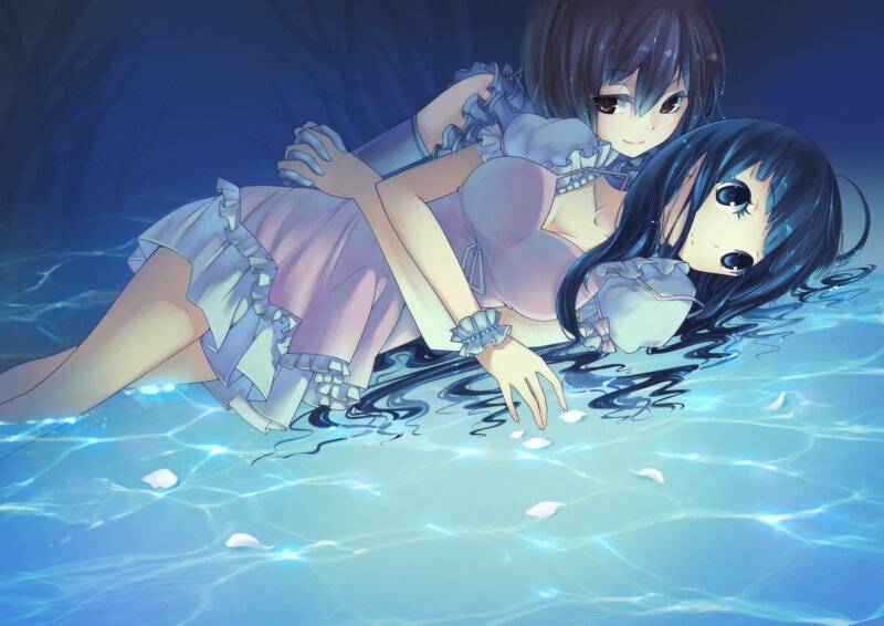 Two girls in a pool at night