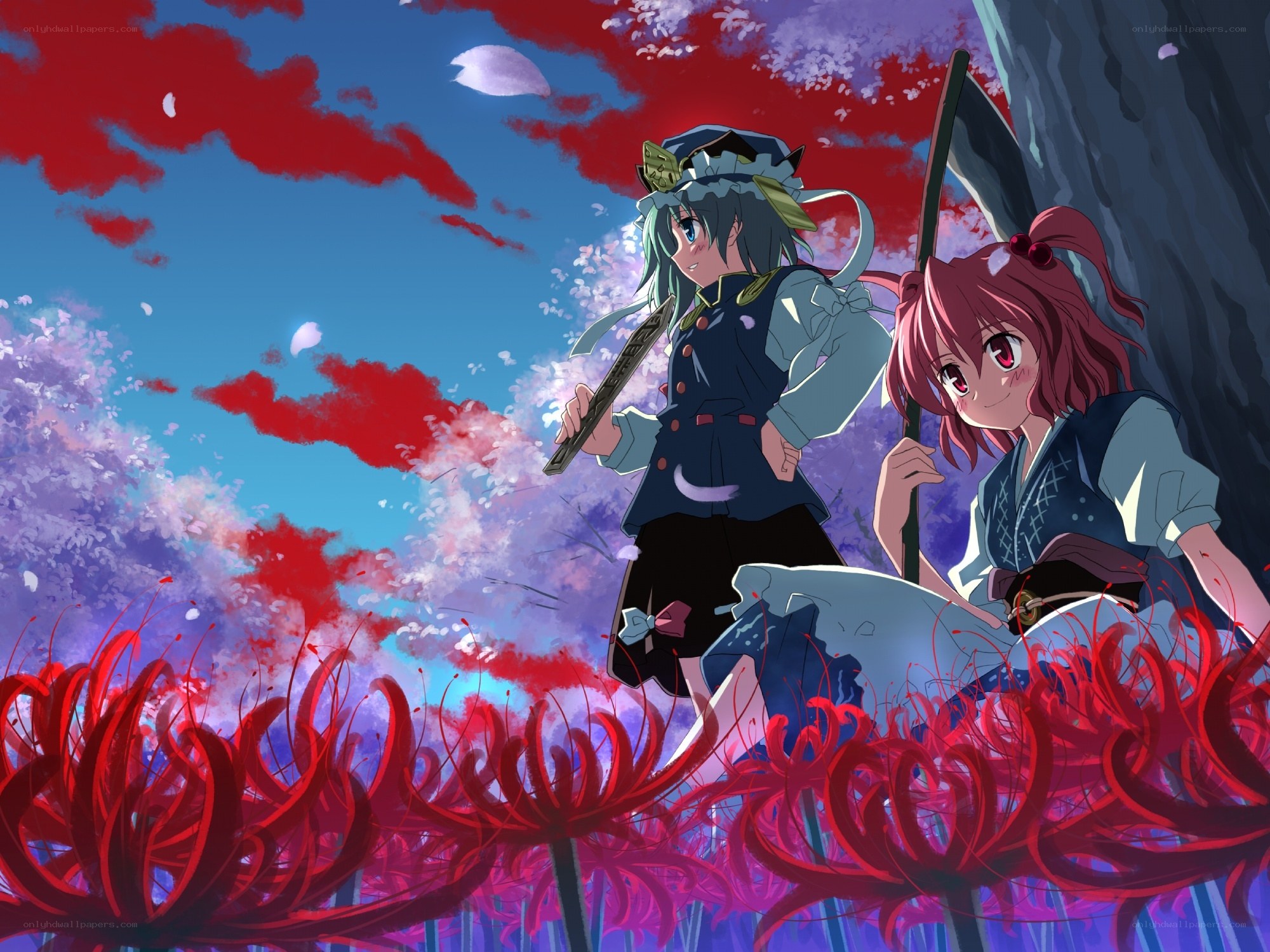 Two girls in a red flower field