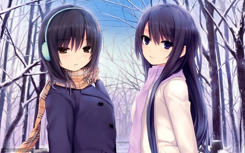 Two girls in a snowy forest