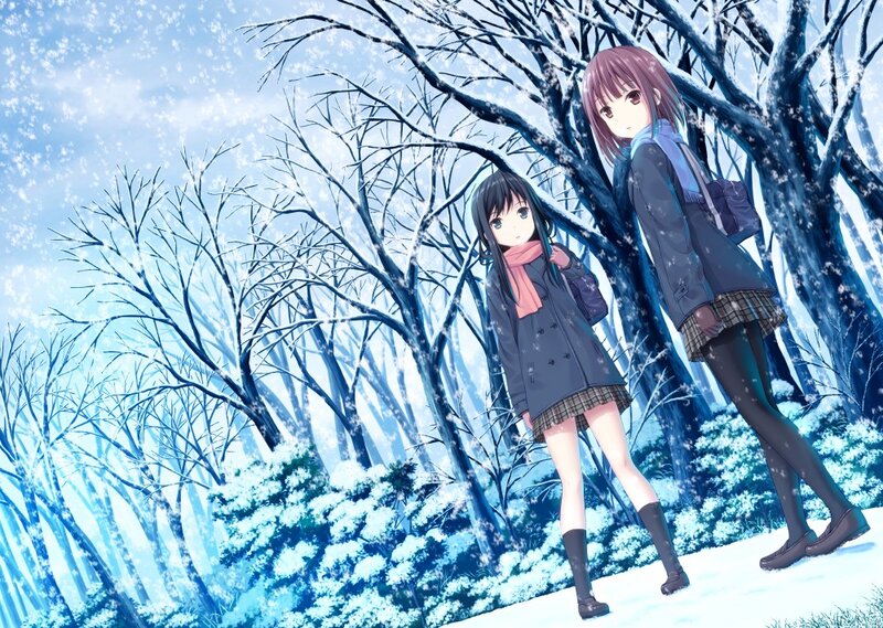 Two girls in a snowy forest