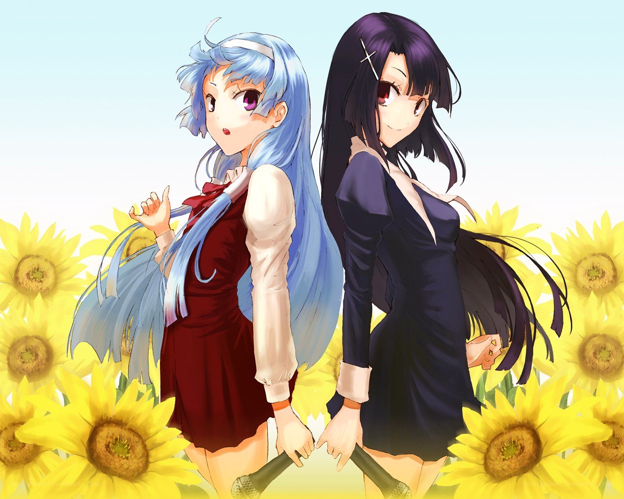 Two girls in a sunflower field