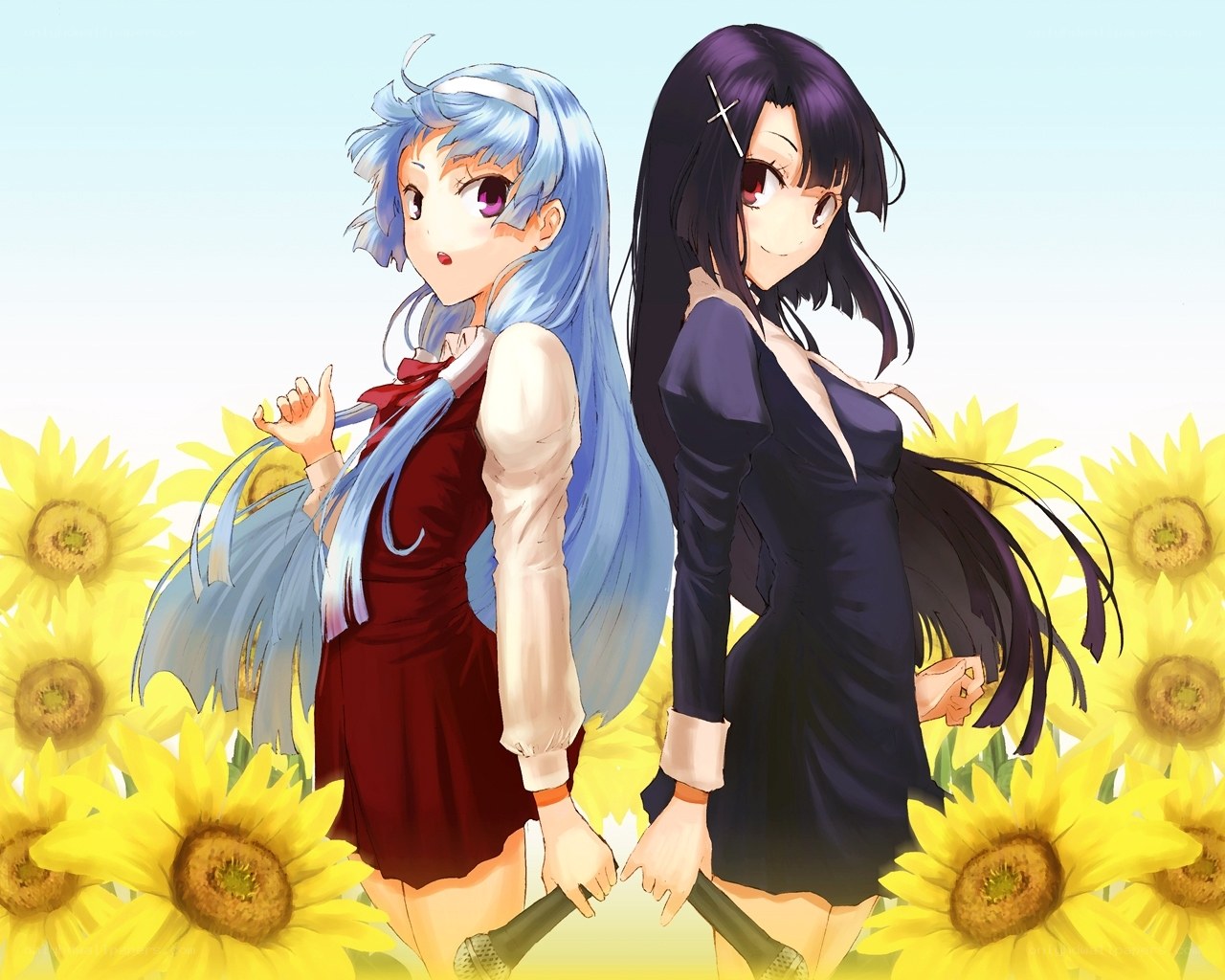 Two girls in a sunflower field