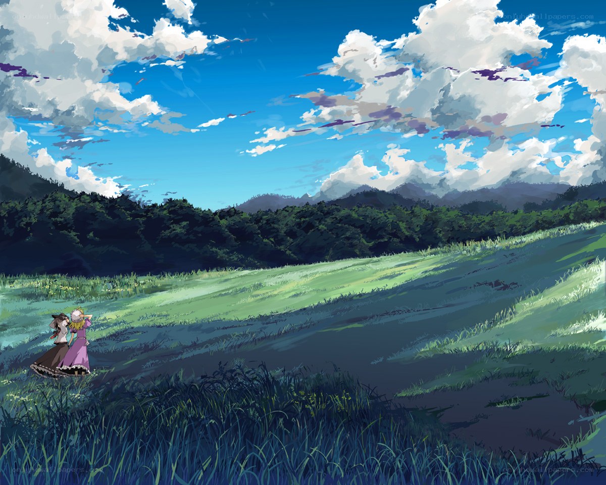 Two girls in a sunlit field