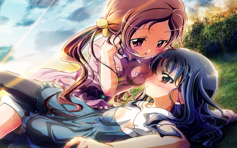 Two girls in a sunny field
