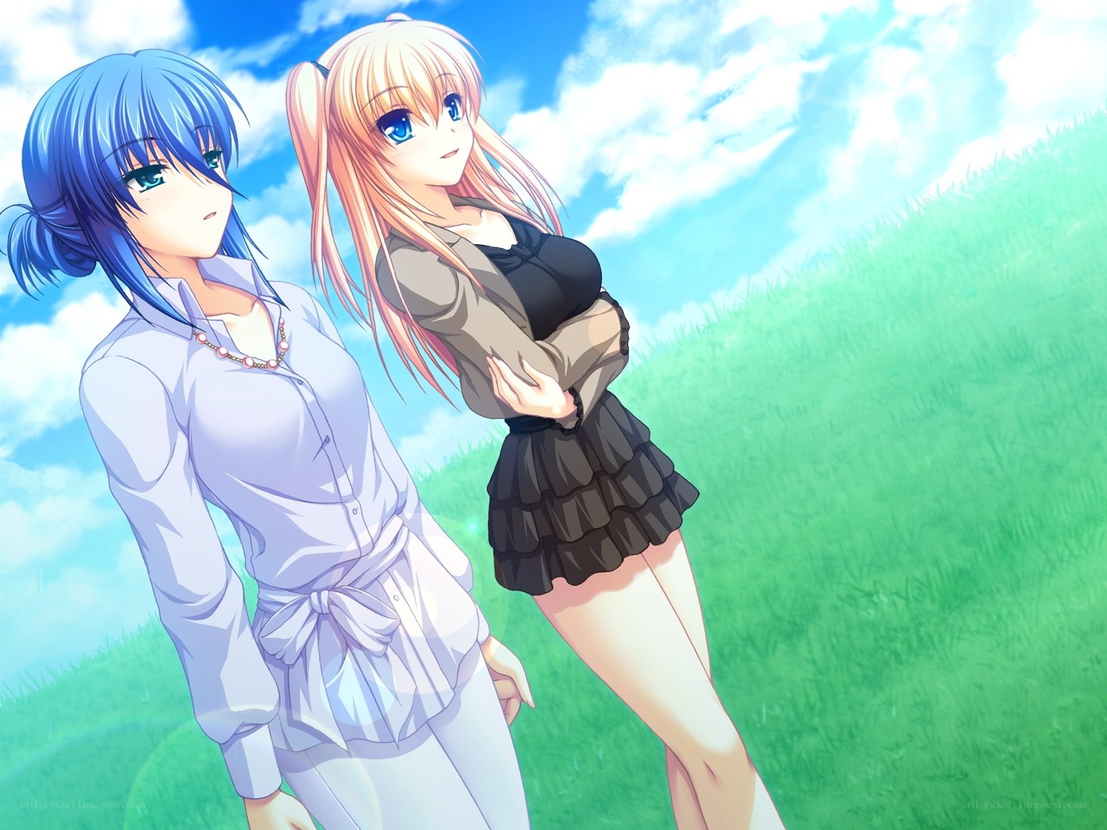 Two girls in a sunny field