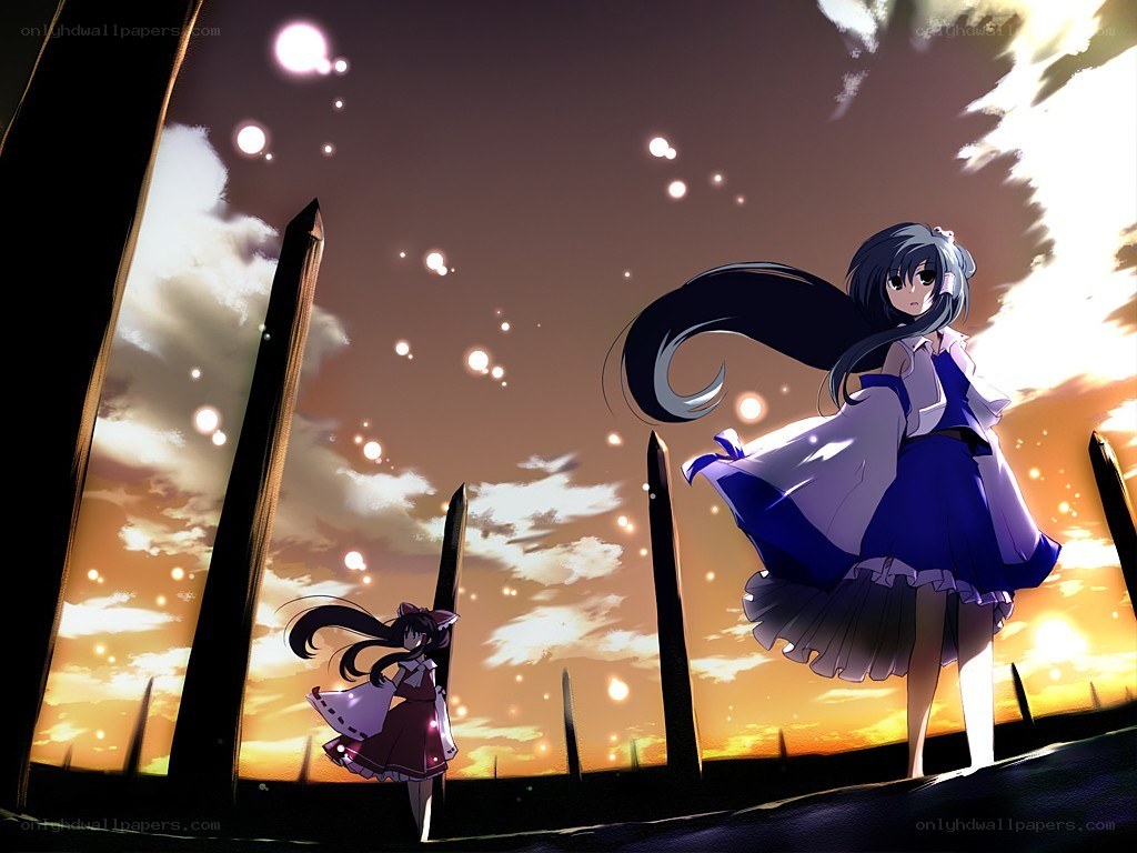 Two girls in a sunset field