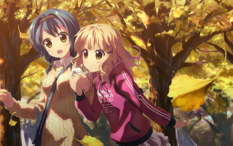 Two girls in autumn forest