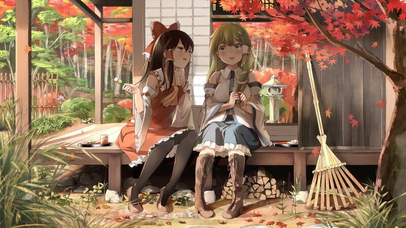 Two girls in autumn garden