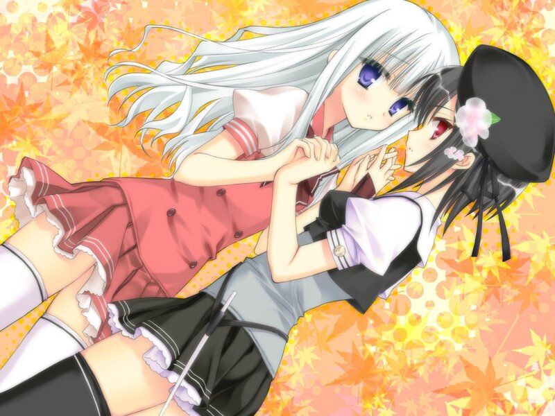 Two girls in autumn leaves