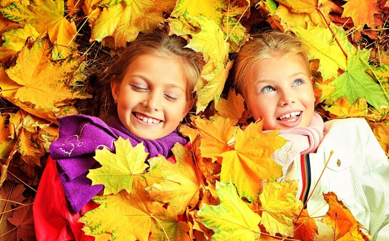 Two Girls in Autumn Leaves — Yellow