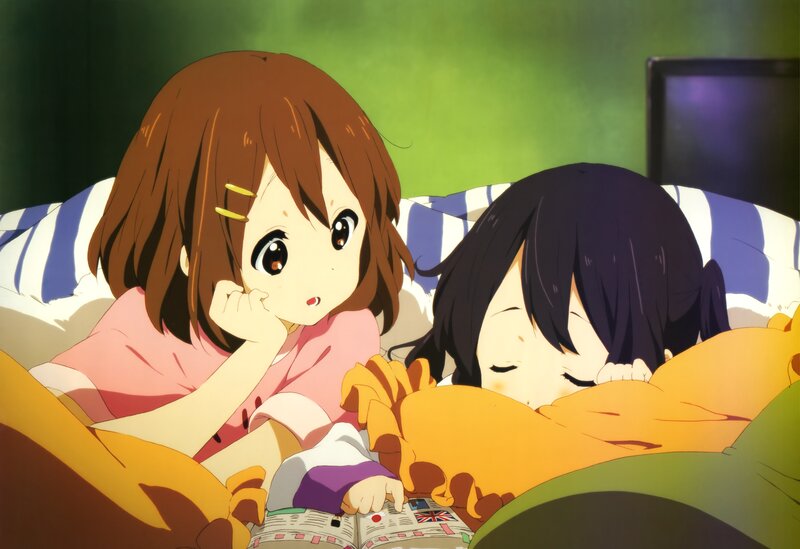 Two girls in bed reading