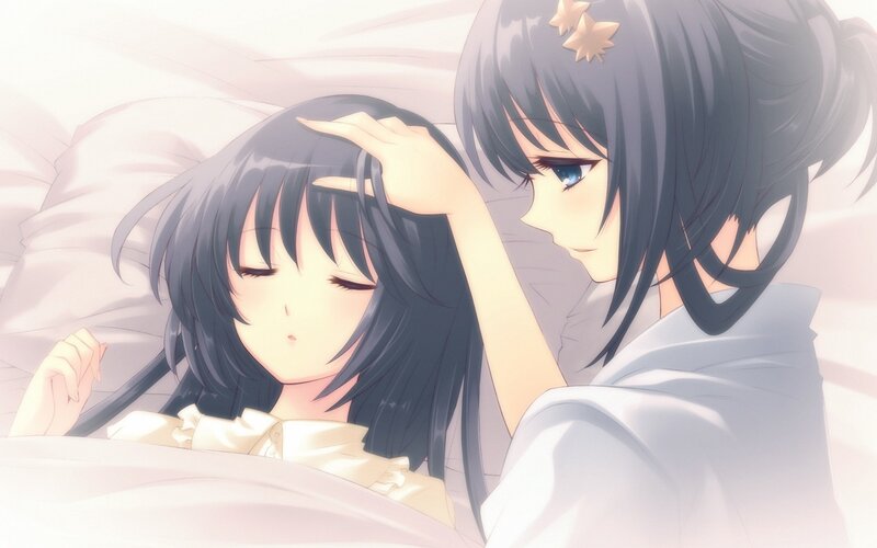 Two girls in bed together