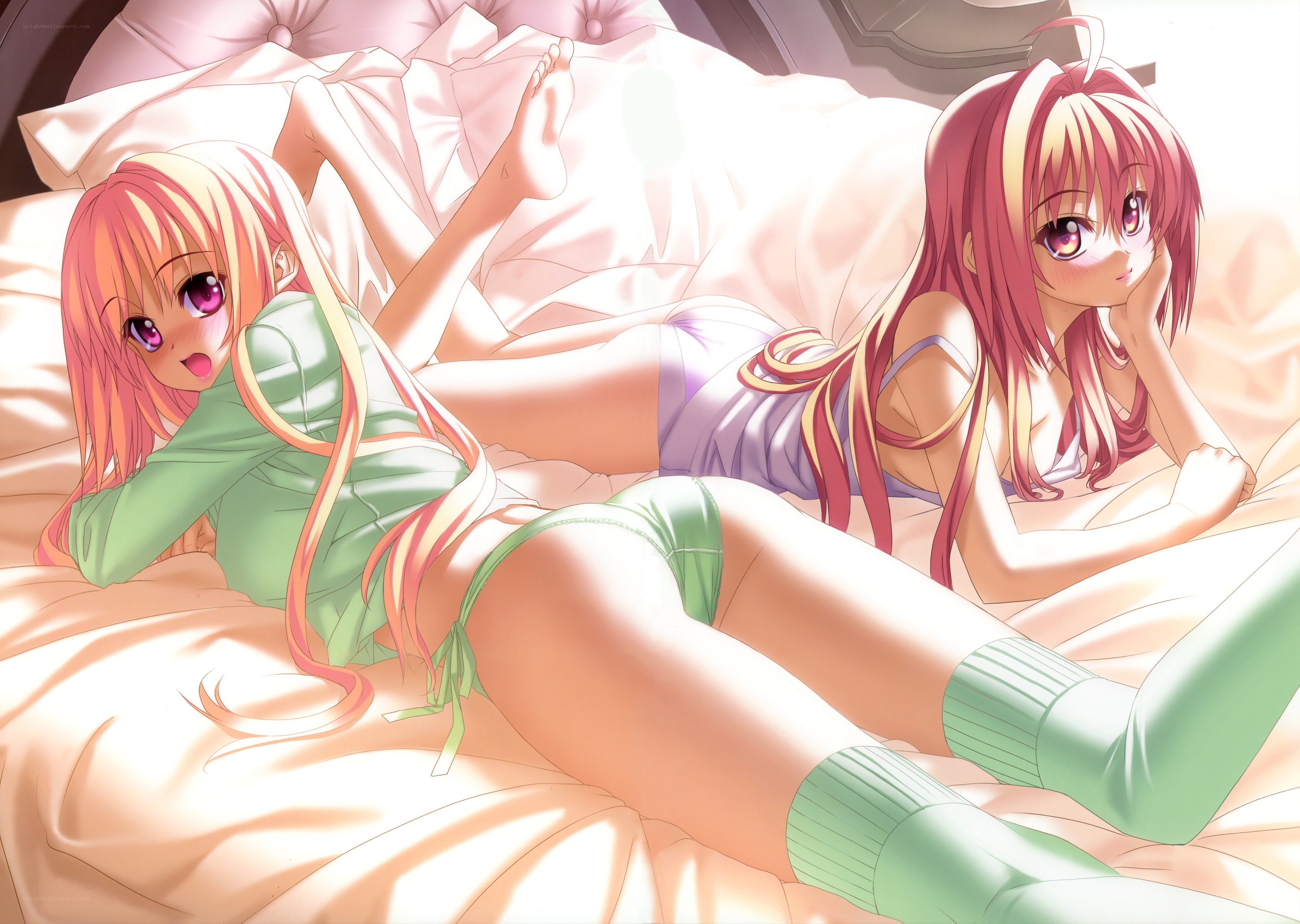 Two girls in bed together