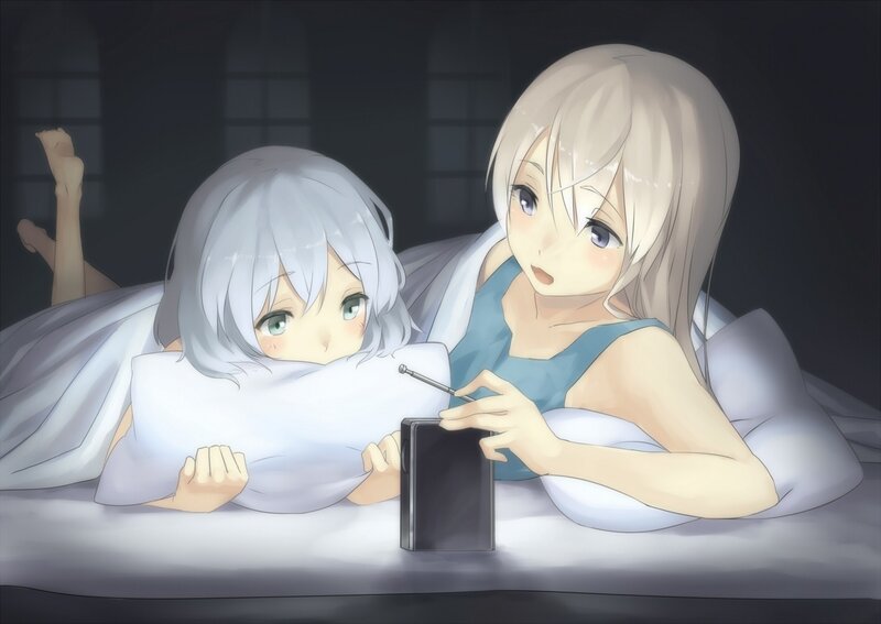 Two girls in bed with radio