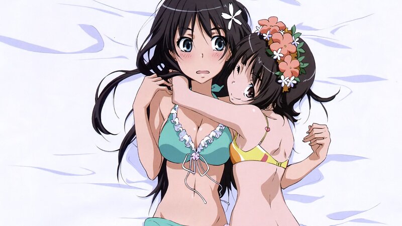 Two girls in bikinis hugging