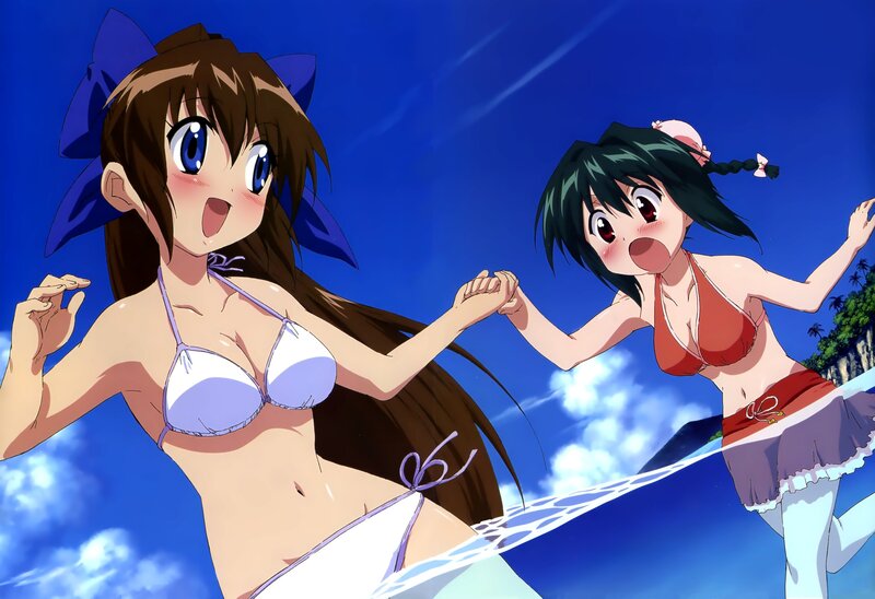Two girls in bikinis on a beach