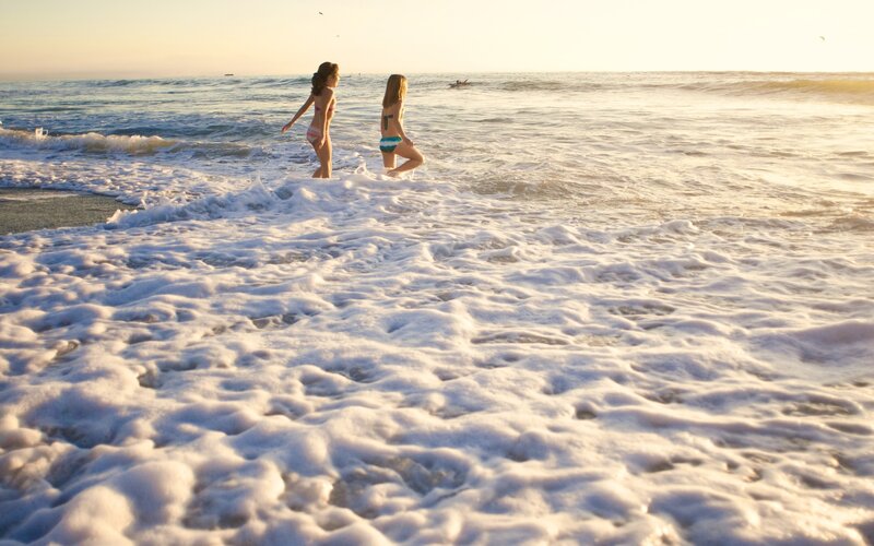 Two Girls in Bikinis — White, Serene, Sunset