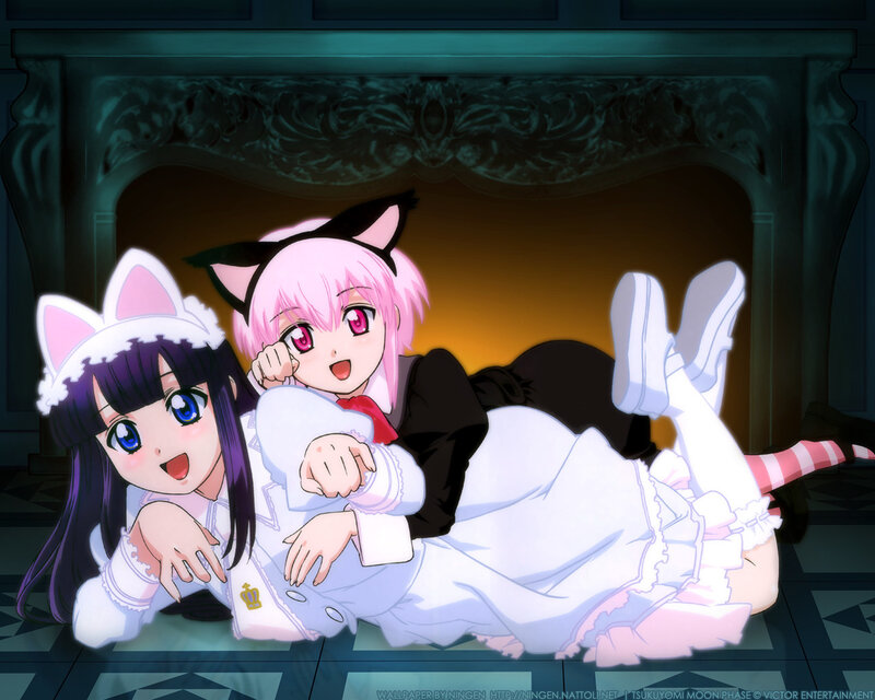 Two girls in cat ears by fireplace