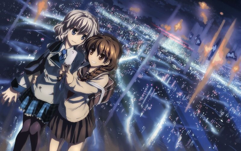 two girls in city at night