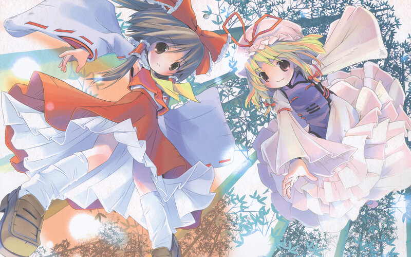 two girls in colorful dresses
