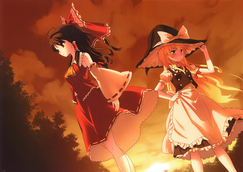 two girls in dresses at sunset