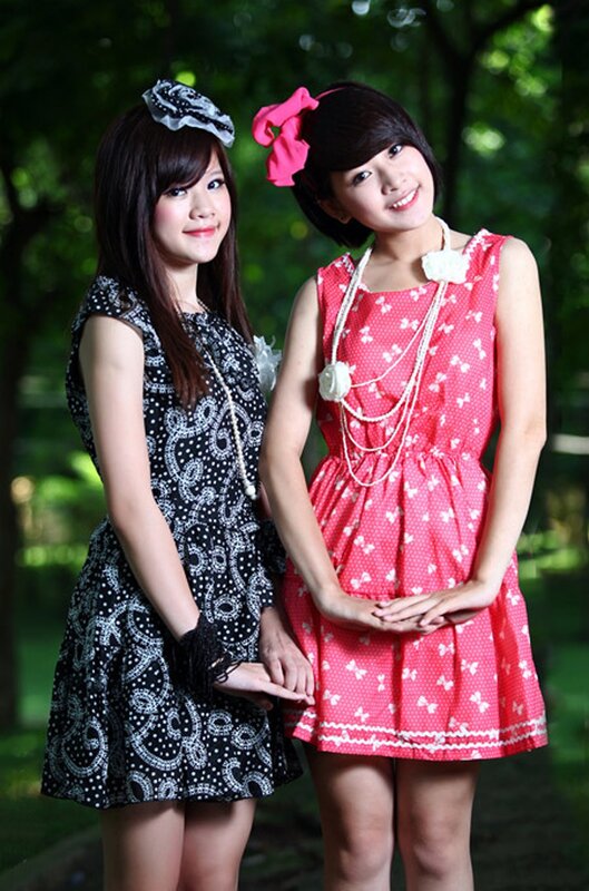 Two girls in dresses outdoors