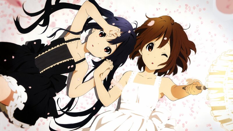 Two girls in dresses with cherry blossoms