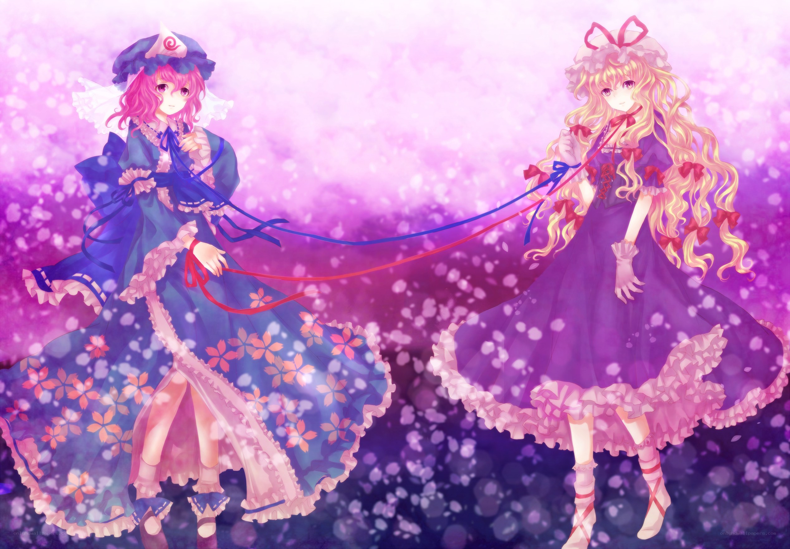 Two girls in dresses with ribbons