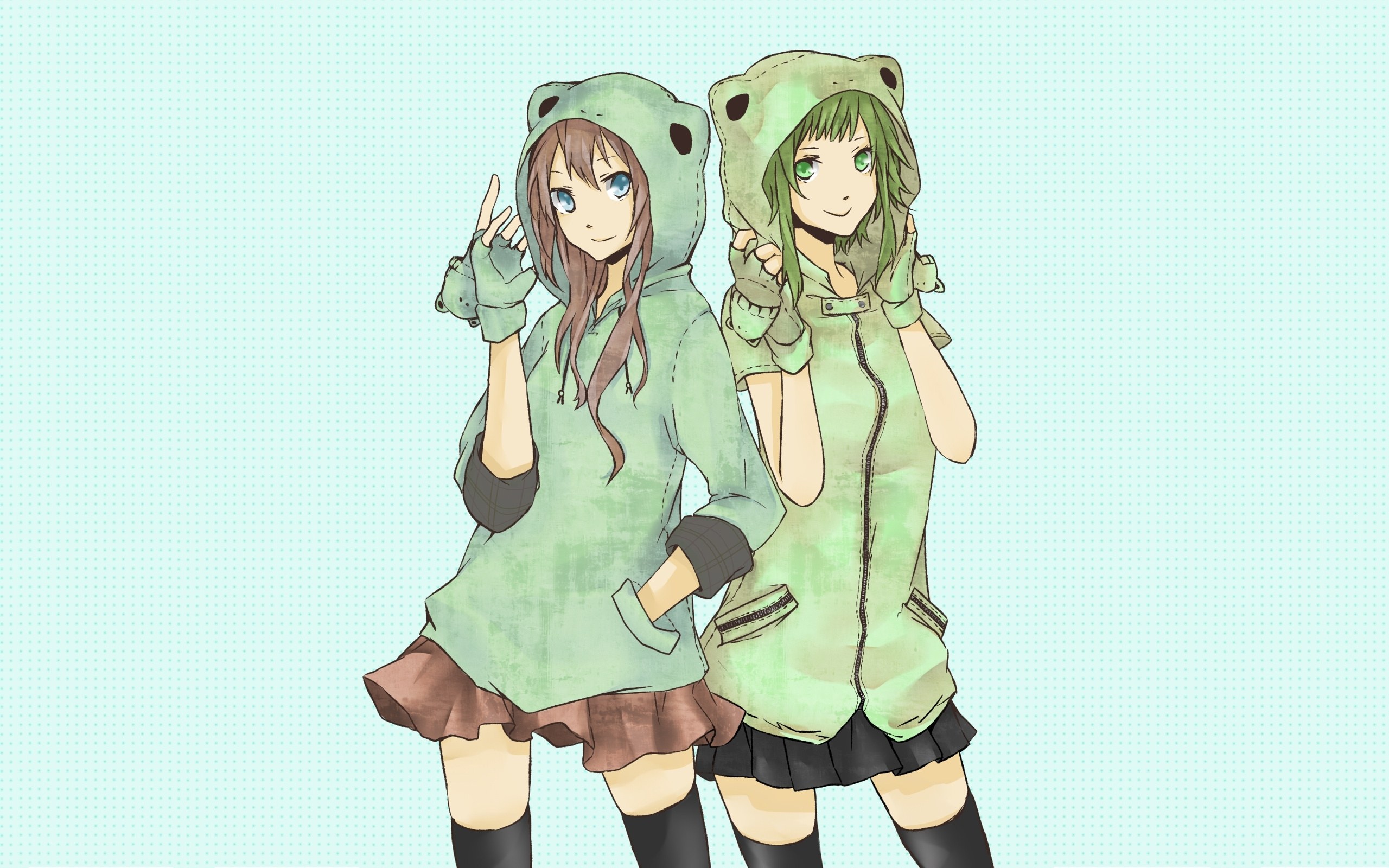 Two girls in frog hoodies