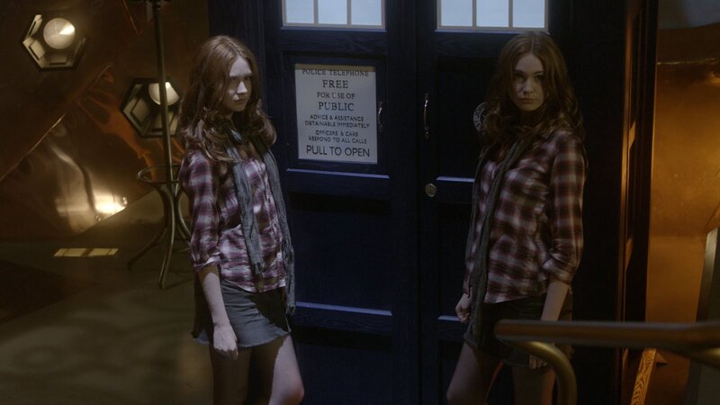 Two girls in front of a police box