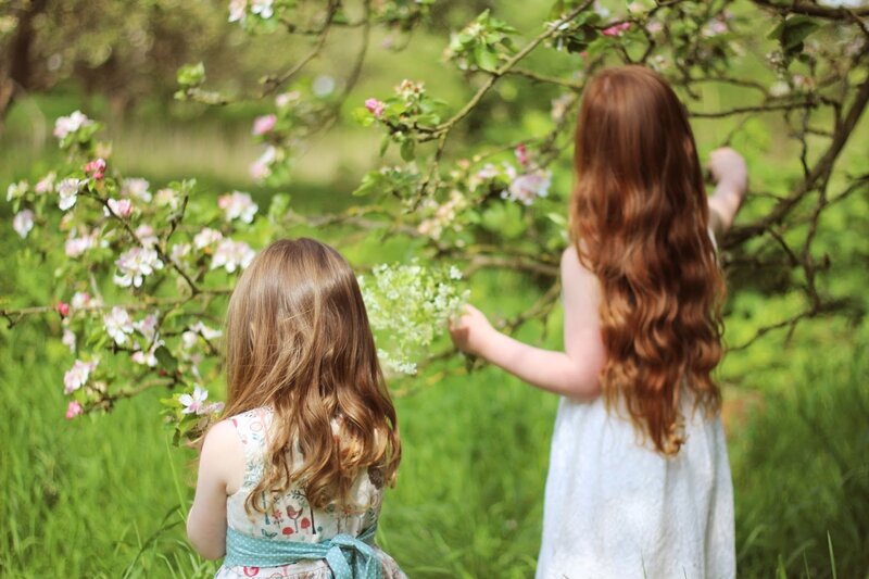 Two Girls in Garden — Green, Serene, Spring, Photograph, Flowering Tree
