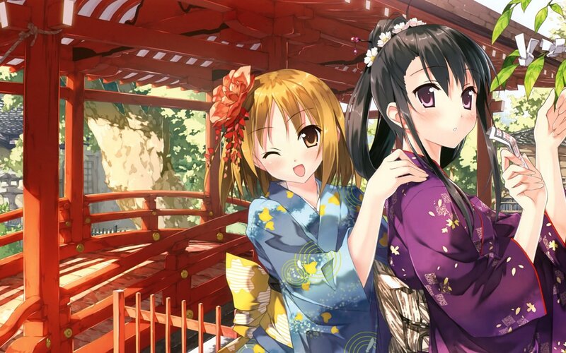 Two girls in kimonos at a shrine