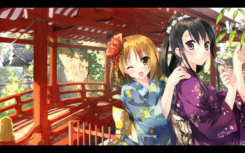 Two girls in kimonos at a shrine