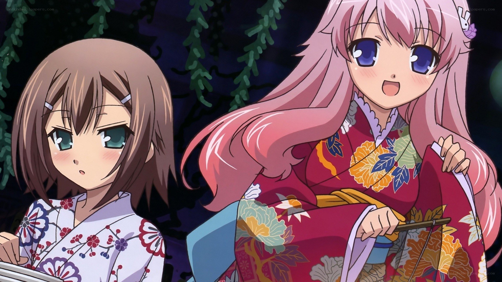 Two girls in kimonos at night