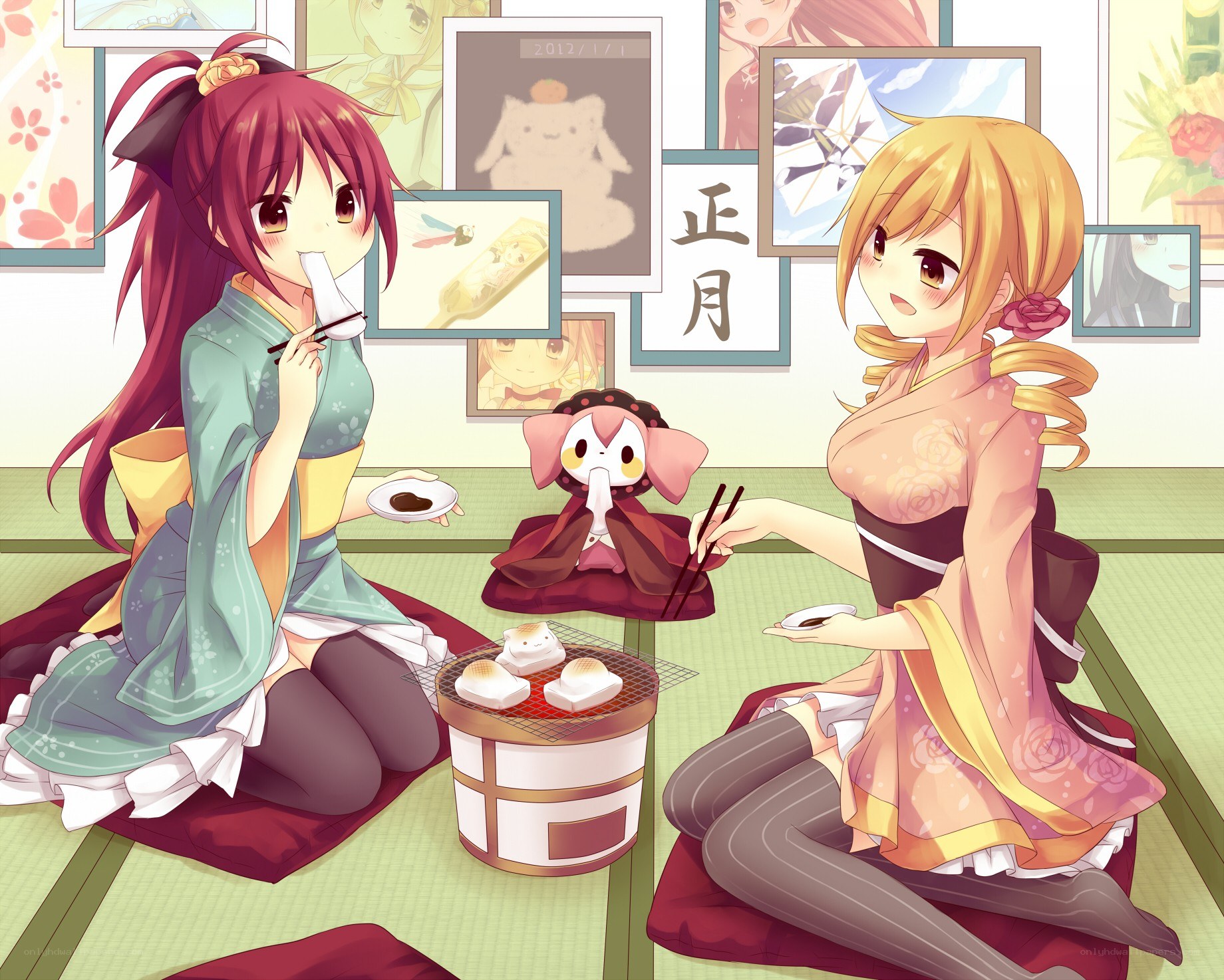 Two girls in kimonos eating