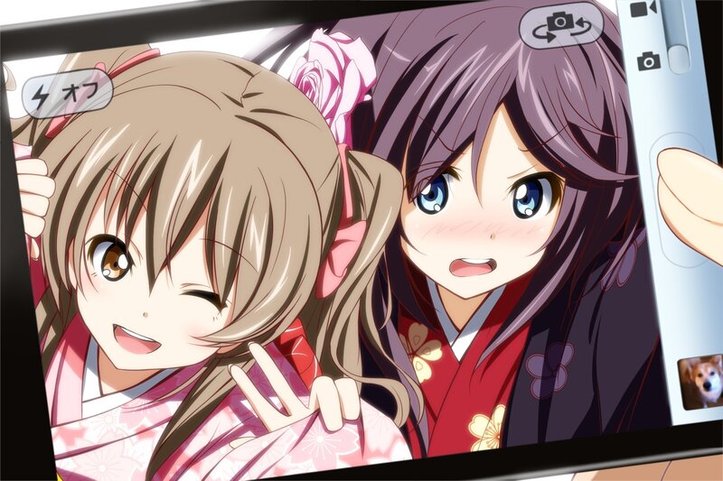 Two girls in kimonos taking a selfie